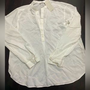 This women rayon relaxed long sleeve blouse is 76% rayon and 24% polyester.